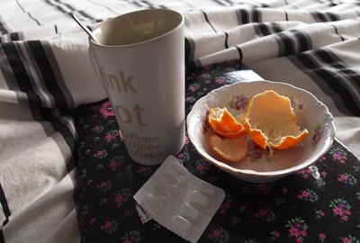 empty glass and orange rinds on a saucer