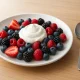 Low-calorie berry yogurt snack, healthy fruit dessert for weight management, fiber-rich natural foods for digestion and satiety