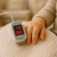 Toddler heart rate being gently monitored at home — cozy and caring setting reflecting normal vital signs.