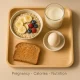 Balanced pregnancy breakfast with oatmeal, boiled egg, toast, and milk on tray — high-calorie nutritious meal idea.