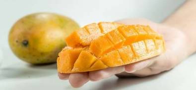 Pieces of mango on hand