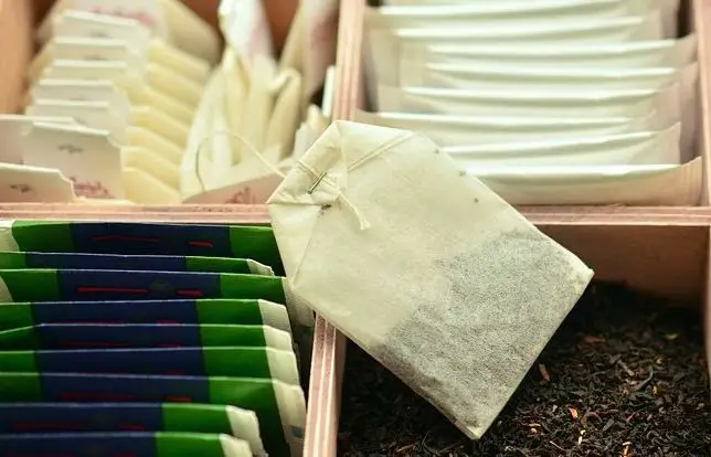 Black tea and green bags of tea