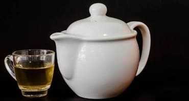 Teapot and teacup with tea