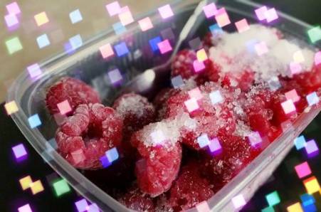 Frozen raspberries in containers
