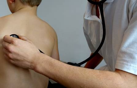 A doctor checks with a stethoscope