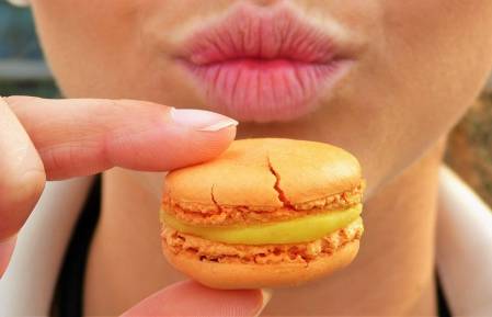 Female mouth and macaroon